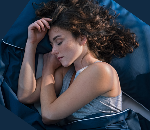 woman sleeping dark blue bedding